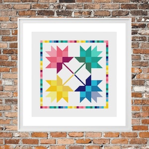 May include: A framed cross-stitch design featuring four colourful maple leaves in a quilt block pattern. The leaves are in shades of pink, teal, yellow, and blue.