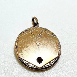 Antique Biedermeier pendant made of tombac with garnet stone