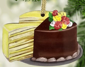 May include: A two-sided Christmas ornament featuring a slice of chocolate cake with red and yellow flowers on top and a slice of layered cake with yellow frosting. The ornament is labeled "2 Sided 2D Flat Ornament Not 3D".