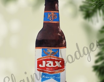 May include: A two-sided flat ornament shaped like a Jax beer bottle. The brown bottle has a blue and white label with the word "Jax" in red. The ornament is hanging from a gold ribbon.