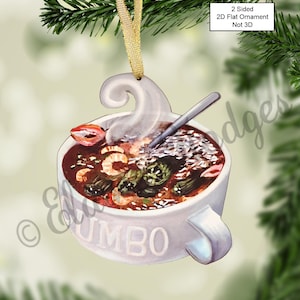 May include: A white ceramic Christmas ornament shaped like a bowl of gumbo with a spoon and steam coming out of the bowl. The bowl has the word "GUMBO" printed on the side.