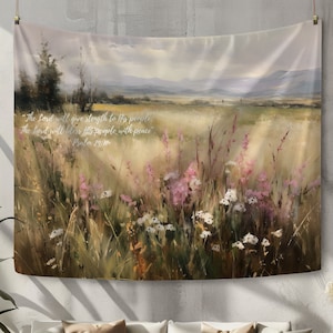 May include: A tapestry with a painting of a field of wildflowers in shades of pink, white, and green. The sky is a soft blue with white clouds. The text "The Lord will give strength to His people: The Lord will bless His people with peace." Psalm 29:11 is printed on the tapestry.