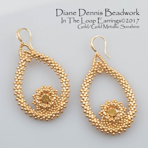 May include: Gold beaded earrings with a teardrop shape and a smaller circle design in the center. The earrings are labeled "In The Loop Earrings©2017 Gold/Gold Metallic Sunshine"