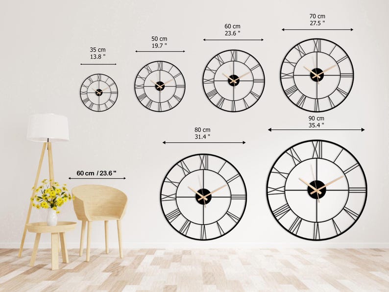 May include: A collection of black metal wall clocks with Roman numeral hour markers. Sizes range from 13.8 inches to 35.4 inches in diameter. The clocks have gold-colored hands and are displayed on a white wall.