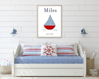 May include: A white framed print with a blue and red sailboat illustration. The text "Miles" is at the top of the print and "July 16, 2020" is at the bottom.