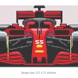 May include: A cross-stitch pattern of a red Formula 1 race car viewed from the front, featuring black tyres with yellow accents, a central cockpit, and the number 55 in white on the nose. The text below reads: Design size: 127 x 71 stitches.