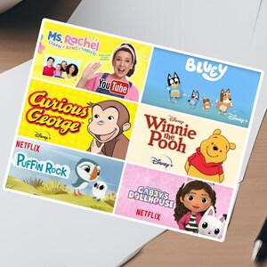 May include: A colorful sticker sheet featuring popular children's shows, including Ms. Rachel, Curious George, Bluey, Winnie the Pooh, and Gabby's Dollhouse. The sticker sheet is perfect for adding a touch of fun to any project.