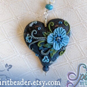 Blue Flower Delicate Flourishes on Dark Heart Clay Pendant Crochet Beaded Necklace