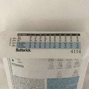 May include: A sewing pattern for a flared skirt with a contrasting applique. The pattern is for sizes 6-24 and includes instructions for a petticoat. The pattern is from Butterick and is number 4114.