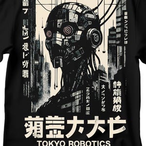 May include: Black t-shirt featuring a detailed illustration of a robotic figure with a cityscape backdrop. The design includes Japanese text and the words "TOKYO ROBOTICS" in white. The robot has a complex, mechanical head.