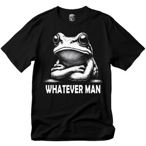 May include: Black t-shirt with a white graphic of a frog with its arms crossed and the text "Whatever Man".