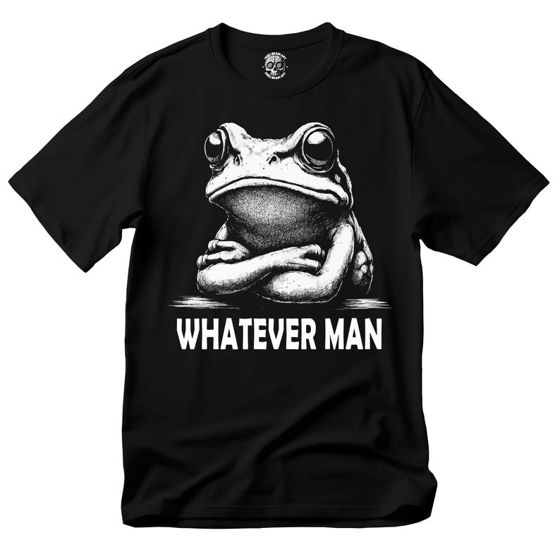 May include: Black t-shirt with a white graphic of a frog with its arms crossed and the text "Whatever Man".