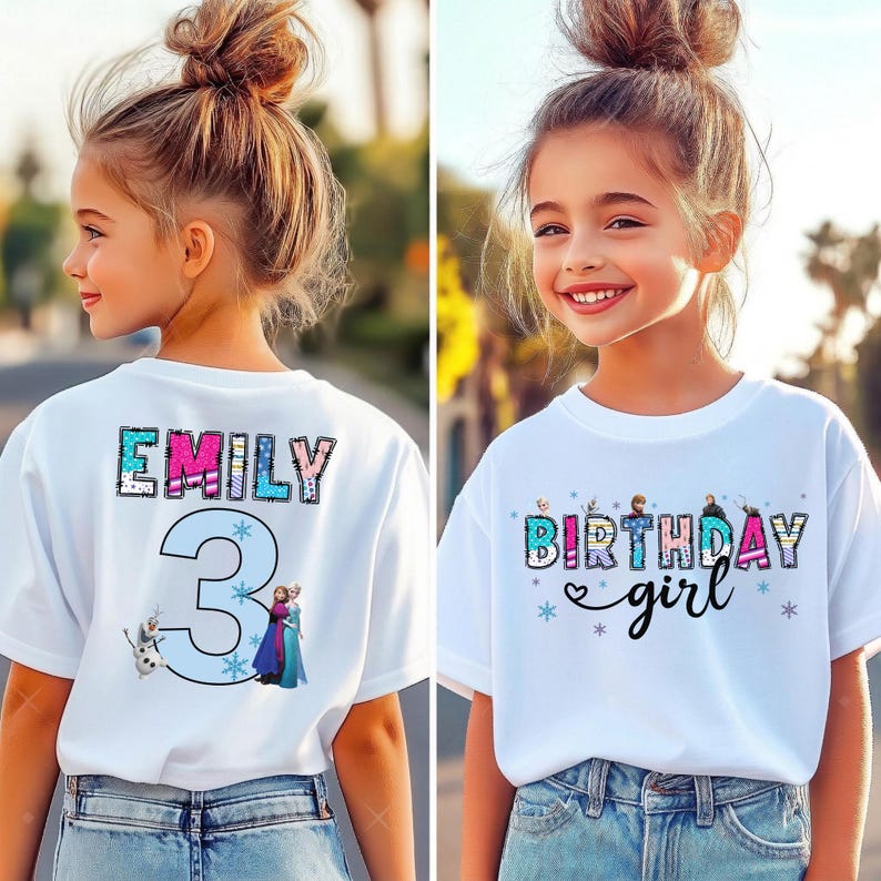 May include: White t-shirts with colorful graphics. One shirt has the name "EMILY" and the number "3" with cartoon characters. The other shirt says "BIRTHDAY girl" with snowflake and heart accents. Both shirts are worn by young girls.