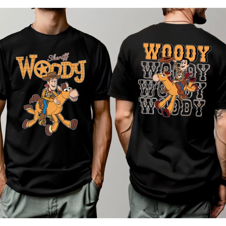 May include: Black t-shirts featuring a cartoon image of Woody riding a horse. The front of the shirt has the word "Woody" in a yellow and orange design, with "Sheriff" above. The back of the shirt has the word "Woody" repeated.