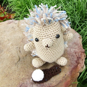 Plush toy hedgehog Woodland animal in crochet. Tan yarn hedgehog with variegated yarn quills. Hedgehog stuffed animal with toy yarn hairbrush for quills. Cute and cuddly plush hedgehog