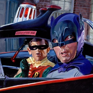 May include: Batman and Robin in the Batmobile, a black and red car with a silver windshield. Batman is wearing a purple cape and a black mask. Robin is wearing a green and red costume with a red mask. The car has a red emergency bat-turn lever.