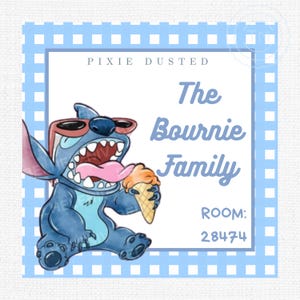 May include: A square sign with a blue and white checkered border and a light blue frame. The sign features a cartoon character holding an ice cream cone, with the text "PIXIE DUSTED" and "The Bournie Family". The room number is 28474.