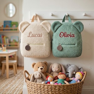 May include: A set of three ceramic nesting bowls in shades of blue, green, and white. The bowls feature a speckled glaze and a simple, modern design. The largest bowl measures approximately 6 inches in diameter.