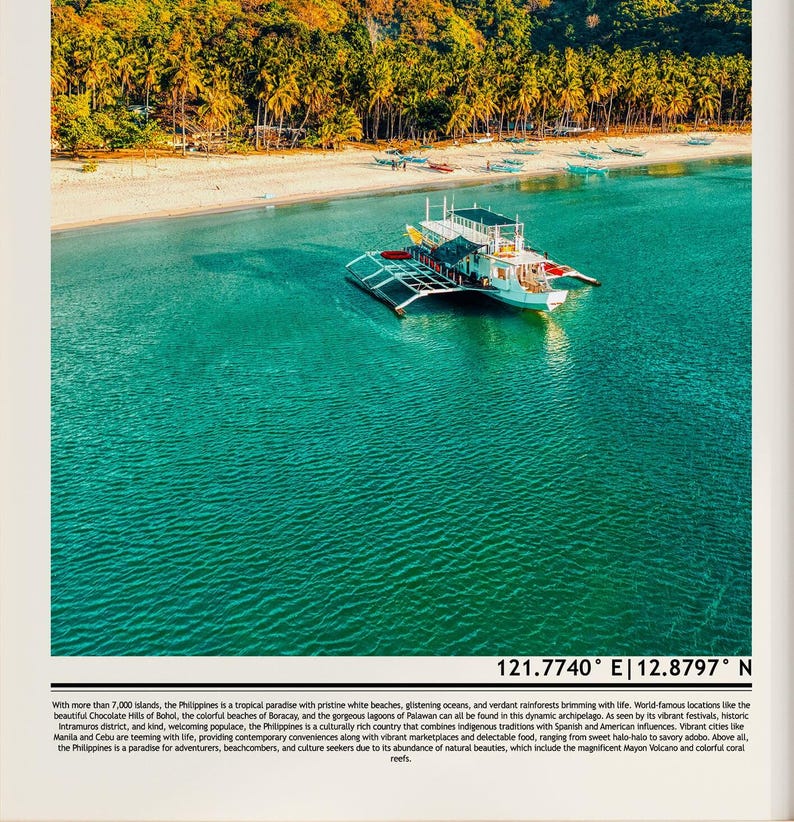 May include: A scenic aerial view of a white boat with a black and silver frame floating on turquoise water near a white sand beach. Lush green trees line the shore. The image includes the coordinates 121.7740&deg; E | 12.8797&deg; N.