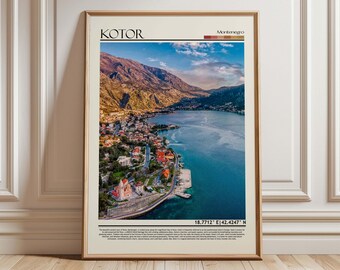 May include: Framed print of Kotor, Montenegro, featuring a scenic aerial view of the bay, mountains, and town. The print has the word "KOTOR" at the top and coordinates at the bottom. The frame is a light brown color.
