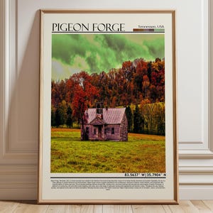 May include: Framed print featuring a scenic view of Pigeon Forge, Tennessee, USA. The image showcases a rustic building in a field, surrounded by colorful autumn trees and a cloudy sky. The print includes the text "PIGEON FORGE" and coordinates.