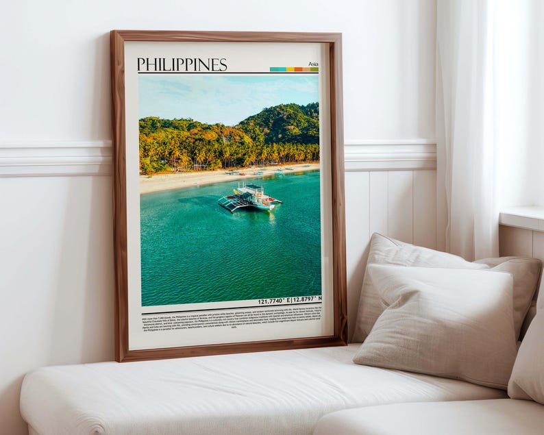 May include: A framed print featuring a vibrant photograph of the Philippines. The image showcases a tropical beach with a boat on turquoise water, lush green hills, and the text "PHILIPPINES" at the top. The frame is a warm brown color.