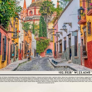 May include: A colorful street scene in Mexico with vibrant buildings, cobblestone streets, and lush greenery. The street is lined with colorful buildings, some with balconies and ornate details. The street is narrow and winding, and there are people walking along it. The scene is bathed in warm sunlight.