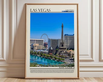 May include: Framed art print featuring a vibrant cityscape of Las Vegas under a clear blue sky. The print includes the text "LAS VEGAS" and a depiction of the Eiffel Tower, a Ferris wheel, and other iconic buildings. The print is in a wooden frame.