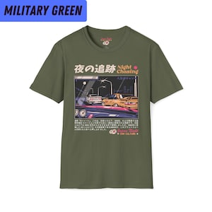 May include: A green t-shirt with a graphic print of a Japanese car scene at night. The text on the shirt reads "Night Chasing" and "Japan Night Car Culture".