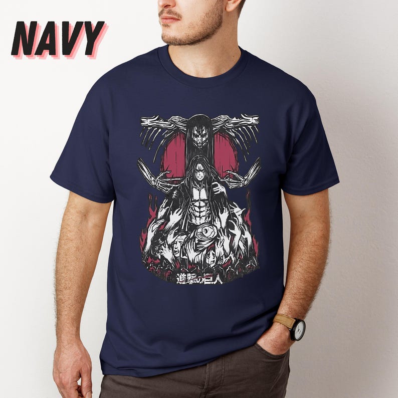 May include: A navy blue t-shirt with a graphic print of a character from the anime Attack on Titan. The character is surrounded by other characters and the text "進撃の巨人" is printed below the graphic.