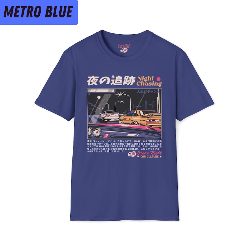 May include: A blue t-shirt with a graphic of two cars driving at night. The graphic includes Japanese text that reads "Night Chasing" and "Japan Night Car Culture".