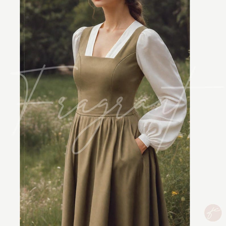 May include: An olive green dress with a square neckline and white sleeves. The dress has a fitted bodice and a flared skirt with pockets. The sleeves are long and gathered at the wrists. The dress is made of a soft, flowing fabric.
