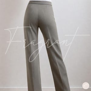 May include: A pair of light gray wide-leg pants with a high waist and a straight leg.