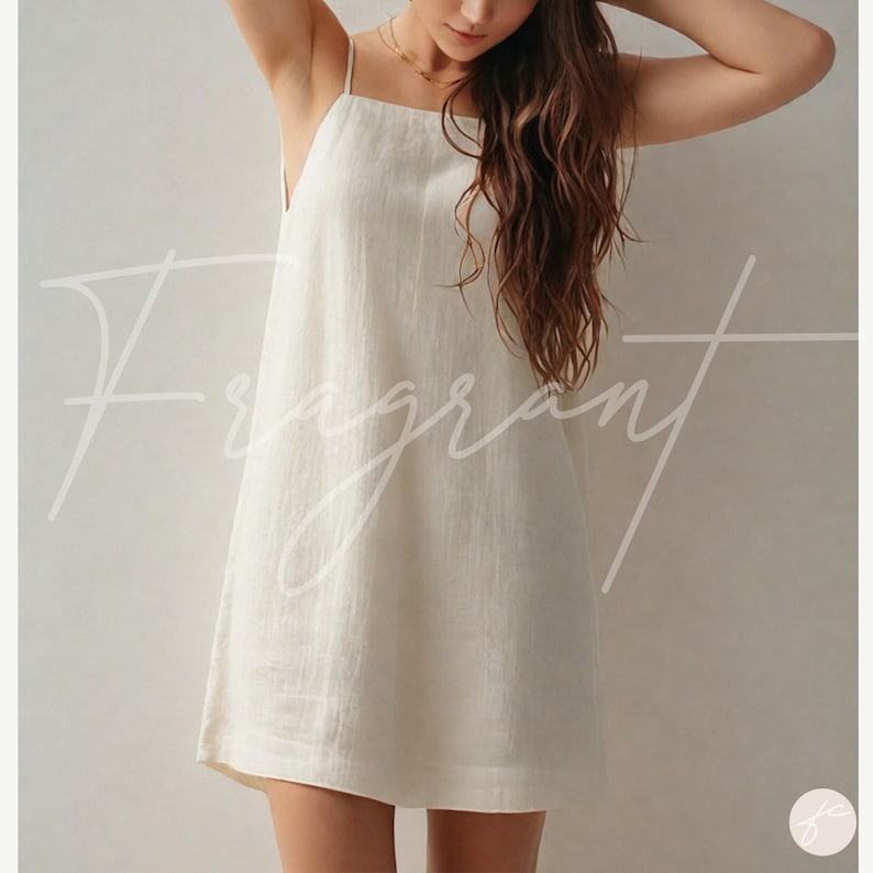 May include: A white sleeveless linen dress with a square neckline.