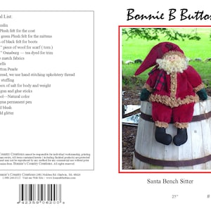 May include: A Santa Claus doll sitting on a wooden barrel. The doll is wearing a red coat, white beard, and black boots. The doll is 25 inches tall. The pattern is called "Santa Bench Sitter" and the pattern number is #6200.