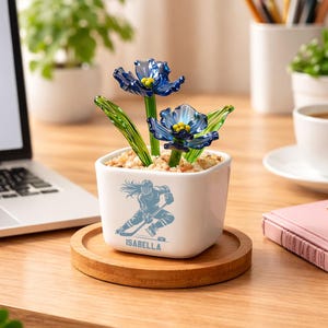 May include: A set of three ceramic mugs with a speckled, matte finish. The mugs are in shades of cream, light brown, and dark brown. Each mug has a simple, minimalist design, perfect for coffee or tea.