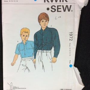 May include: A sewing pattern for boys' shirts, sizes 8-10-12-14. The pattern is from Kwik Sew Pattern Co., Inc. and is number 1972.