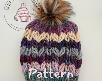 May include: A colorful knitted beanie with a faux fur pom pom. The beanie has a chevron pattern and is made with a chunky yarn. The beanie has the word "Pattern" written on the front.