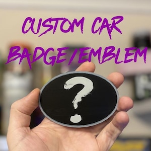 May include: Custom car badge emblem with a question mark in a white oval on a black background. "Please read: Message required prior to purchase!"