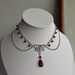 collier chanel ras de cou camelia en email logo