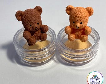 May include: Two small teddy bear figurines, one brown and one orange, sit in clear plastic containers. The text "LILYPADS - TEDDY BEARS" is at the top. The text "WET THE SPONGE - WORKS WITH WAX OR PUTTY KEEPS ABS FROM STICKING" is at the bottom.