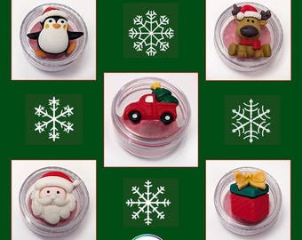 May include: Christmas Lilypads in clear containers, featuring a penguin, reindeer, red truck with a Christmas tree, Santa Claus, and a wrapped gift. The image includes snowflakes and the text "CHRISTMAS LILYPADS" and "CHOICE OF 4 REGULAR LILYPADS OR 1 LARGE LILYPAD".