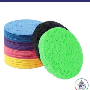 May include: A stack of colorful replacement lilypad sponges in blue, purple, pink, and yellow. Three individual sponges are black and green. The text "REPLACEMENT LILYPAD SPONGES" is at the top. The text "SET OF 6 SMALL SPONGES FOR ORIGINAL SIZE LILYPADS" is at the bottom.