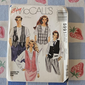 May include: A McCall's 5991 sewing pattern envelope for vests in size extra-large. The front cover features illustrations of four different vest styles worn over shirts, including a patterned vest, a plaid vest, a solid vest, and a pink buttoned vest.