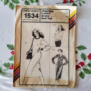 May include: A sewing pattern for a chemise, t-shirt, dress, and top. The pattern is for sizes 28-44 and is designed for knit fabrics. The pattern number is 1534. The pattern is from Stretch & Sew.