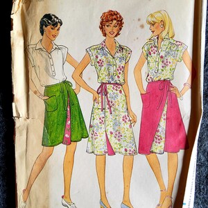 May include: A vintage sewing pattern for a wrap skirt. The pattern shows three women wearing different versions of the skirt in green, floral, and pink. The pattern number is 4299 and the price is $2.75.
