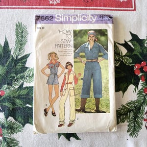 May include: Vintage Simplicity sewing pattern 7562, size 10. The pattern features illustrations of three different outfits, including a jumpsuit and a romper. The cover includes the text "How to Sew Pattern".