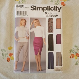 May include: A Simplicity 5259 sewing pattern envelope for six bottoms made easy. The front displays illustrations of various skirts and pants, including a magenta pencil skirt with a side slit and cropped trousers. Size range UU 16, 18, 20, 22.