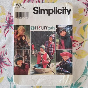 May include: Simplicity sewing pattern 9781 for making children's hats and scarves. The pattern includes six different designs, with a variety of colors and patterns. The pattern is for sizes S, M, and L.