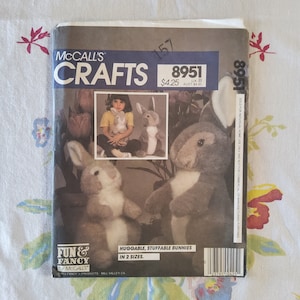 May include: A McCall's Crafts sewing pattern for making huggable, stuffable bunnies. The pattern is number 8951 and costs $4.25. The pattern includes instructions for making two sizes of bunnies.